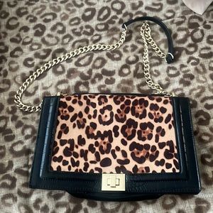 Cute leopard and black leather purse with good chain accent strap